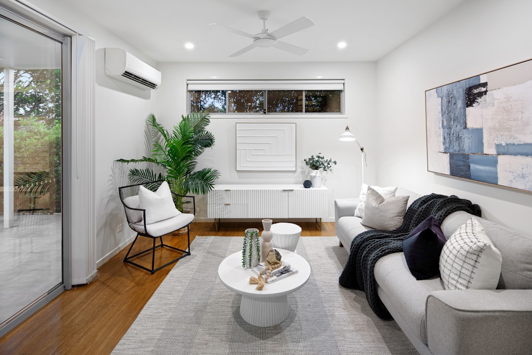 A living room filled with furniture and a ceiling fan